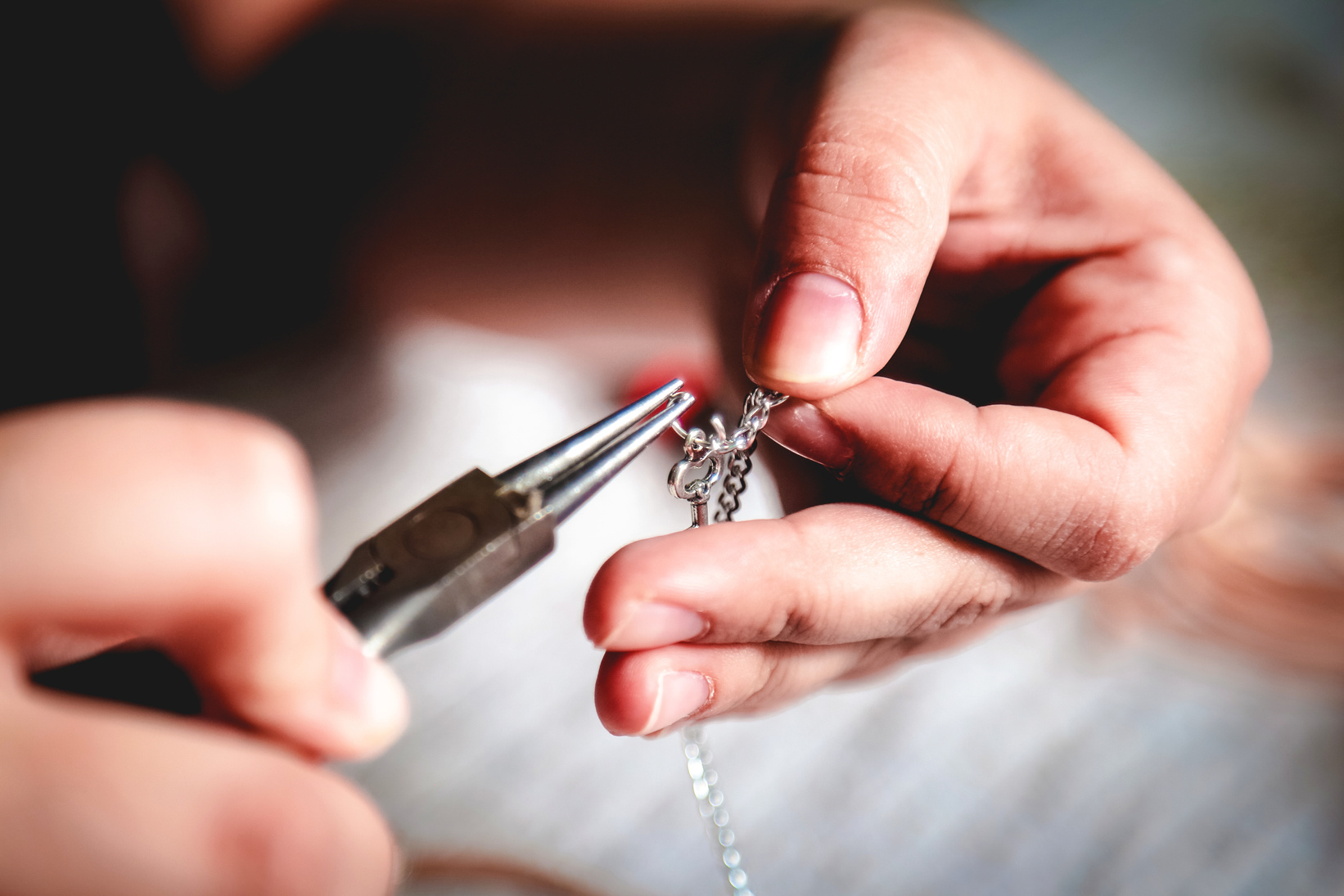Young woman crafting jewelry